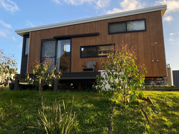 The Hideaway: 8m Ply & Charcoal Tiny Home on Wheels, Skylight Nook, Soaking Tub & Outdoor Bath