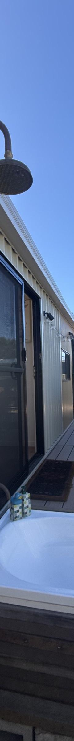 The Tallebudgera: 9.6m x 3m Tiny Home on Wheels, Ground-Floor Bedroom, Outdoor Bath and Warranty thumbnail 10