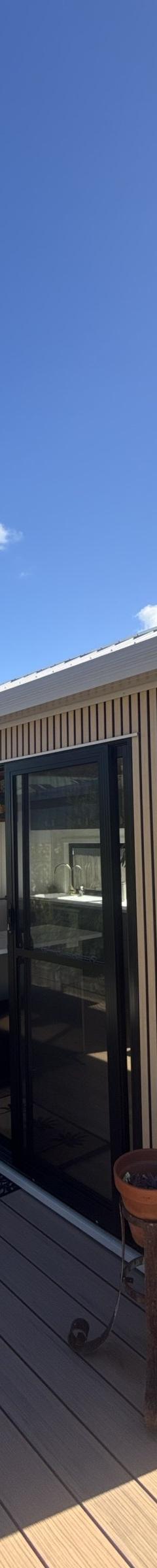 The Tallebudgera: 9.6m x 3m Tiny Home on Wheels, Ground-Floor Bedroom, Outdoor Bath and Warranty thumbnail 2
