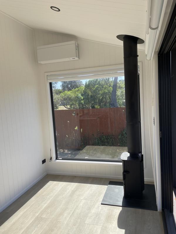Fireside: Single-Level 8.4m Tiny Home on Wheels, Charnwood Wood Fireplace, Air Con & Composting Toilet