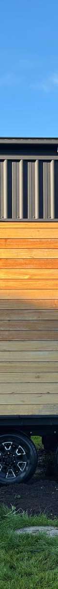 Honey Timber & Black 8.4m Tiny Home on Wheels — Wood Fireplace, Double Glazing & Loft Bedroom thumbnail 1
