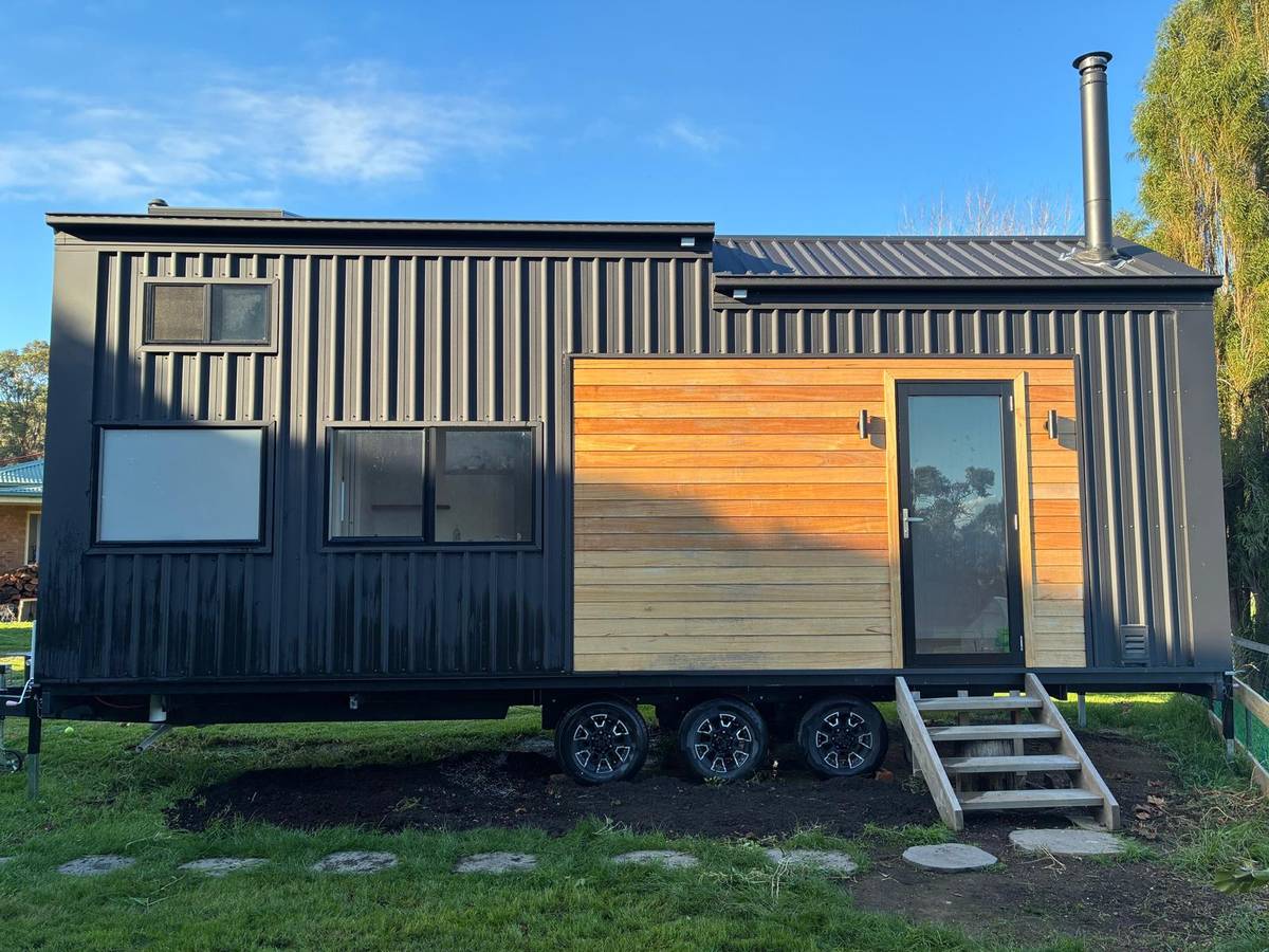 Honey Timber & Black 8.4m Tiny Home on Wheels — Wood Fireplace, Double Glazing & Loft Bedroom - Image 1